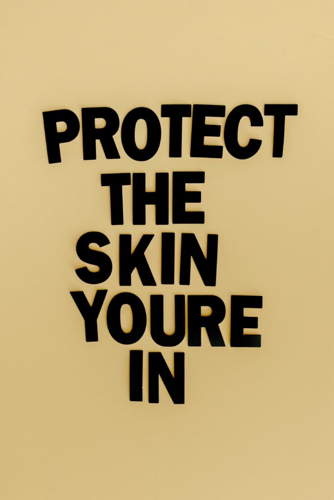 Protect the Skin You're In Lettering - Northwest Dermatology Group